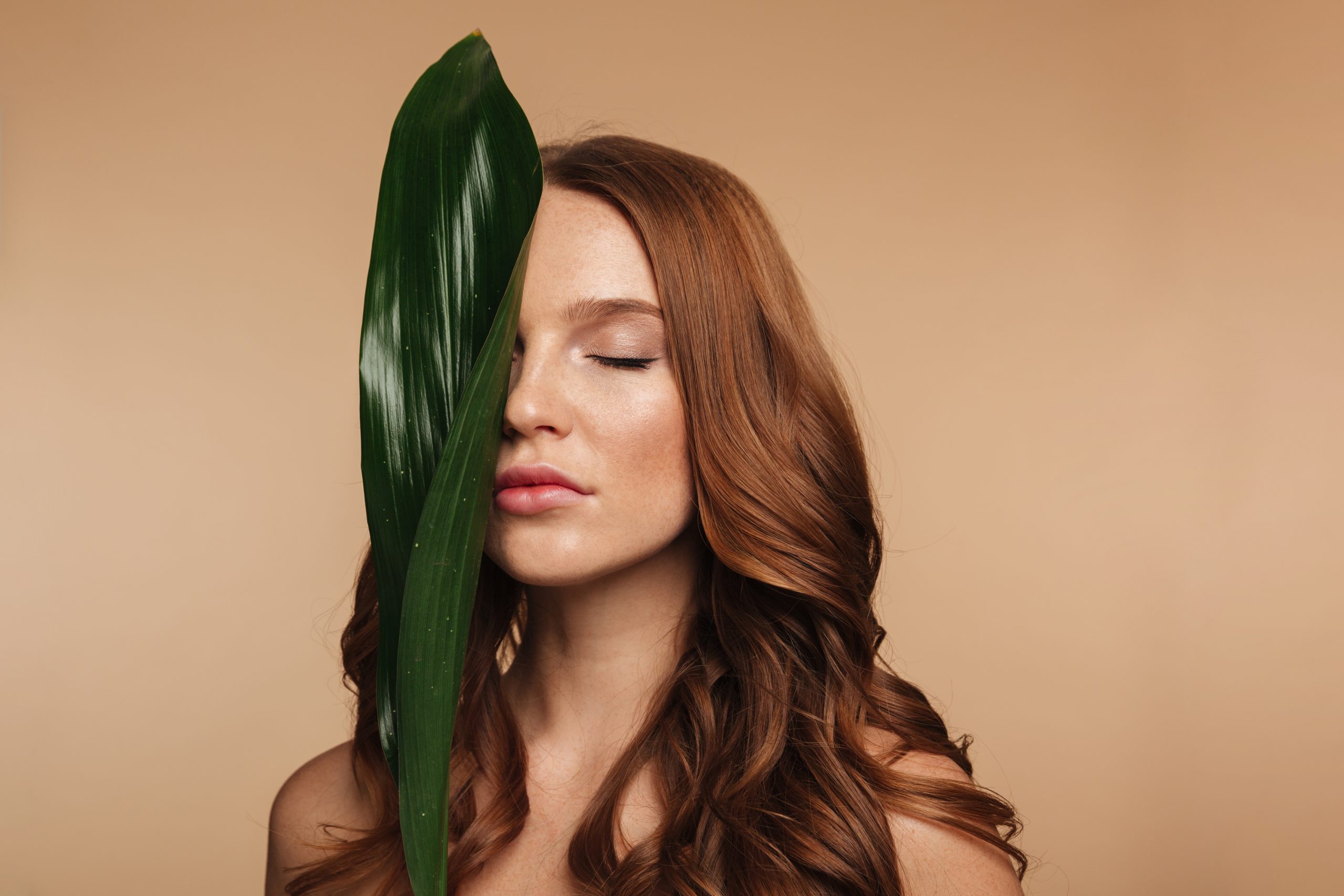Beauty portrait of sensual ginger woman with long hair